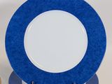 a stack of blue and white plates sitting on top of each other
