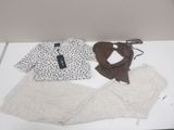 three pieces of clothing that are on a white table