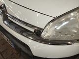 a close up of a white car with a black bumper