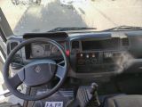 steering wheel of a vehicle with a sticker on the dashboard