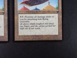 two cards that have a picture of a flying saucer on them