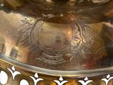 a large metal bowl with a decorative design on it