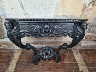 a black table that has a lion head on it