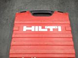a close up of a red tool box on a black surface