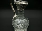 an image of a glass pitcher on a black background