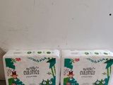 two boxes of toilet paper sitting on top of a white counter