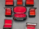 a lot of red and black boxes on a table
