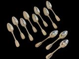 a lot of spoons and spoon spoons on a black background