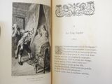 an open book with a picture of a man and a woman in bed