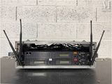 a radio that is sitting on a table with a brick wall in the background