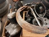 a pile of old tires and other junk on the ground