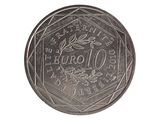une image d'une pièce de monnaie en gros plan sur fond blanc