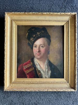 portrait of a young man in a red coat and a black hat