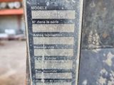 a close up of a machine that is sitting in a warehouse
