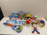 a lot of toys and books on the table