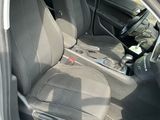 the interior of a car with the front seats folded down