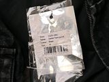 an image of a label on a black jacket