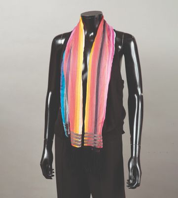 a mannequin with a multi colored scarf on it ' s neck
