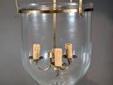 an image of a chandelier made of glass and brass
