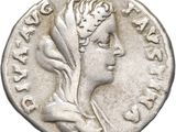 a silver coin with a woman ' s head on it