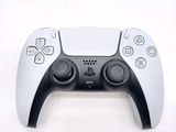 a close up of a video game controller on a white surface