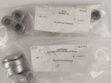 two pieces of metal fittings on a white surface