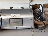 a silver machine that is sitting on a counter