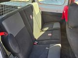 two seats in the back of a white van