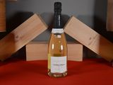 a bottle of wine that is sitting on a table