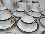 a lot of cups and saucers on the table