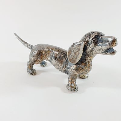 statue of a dachshund dog on a white background
