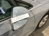 a car with a sticker on the side mirror of it