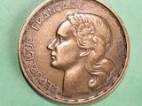 a coin with a picture of a woman on it