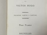 an open book with a picture of the title of les miserables and a picture of the title of les miserables