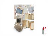 a pile of old letters and old photos on a table