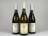 three bottles of wine sitting next to each other on a table