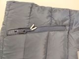 grey jacket with zippers and zippers on the side of the jacket