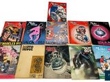 a lot of books that are sitting on a table