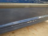 a close up of a car ' s door handle and door sill