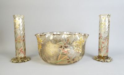 three vases and a bowl sitting next to each other
