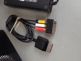 two cables connected to a laptop on a table