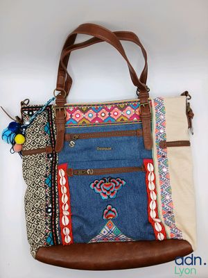 a close up of a purse with a purse strap on it