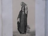 an old picture of a woman carrying a bowl on her head