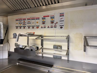 an image of a commercial kitchen with a lot of counter space