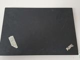 a black surface with a piece of paper on it