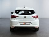 the rear end of a white car in a white room