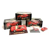 three red toy cars are sitting on display in a display case