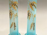 pair of blue glass vases with gold flowers on them