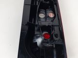 a close up of a black plastic object on a white surface