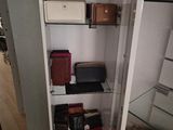 a glass display case with many different items on it